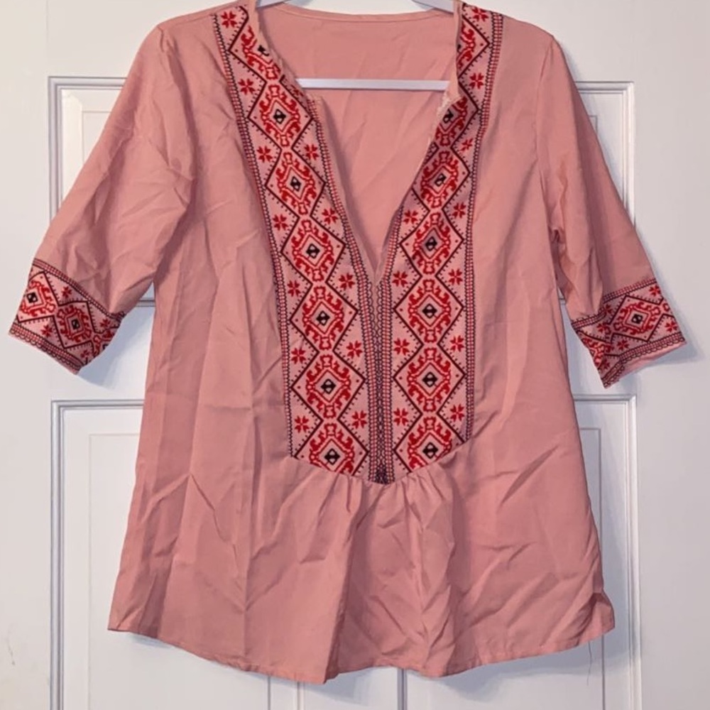 Two of the same shirts different colors size S